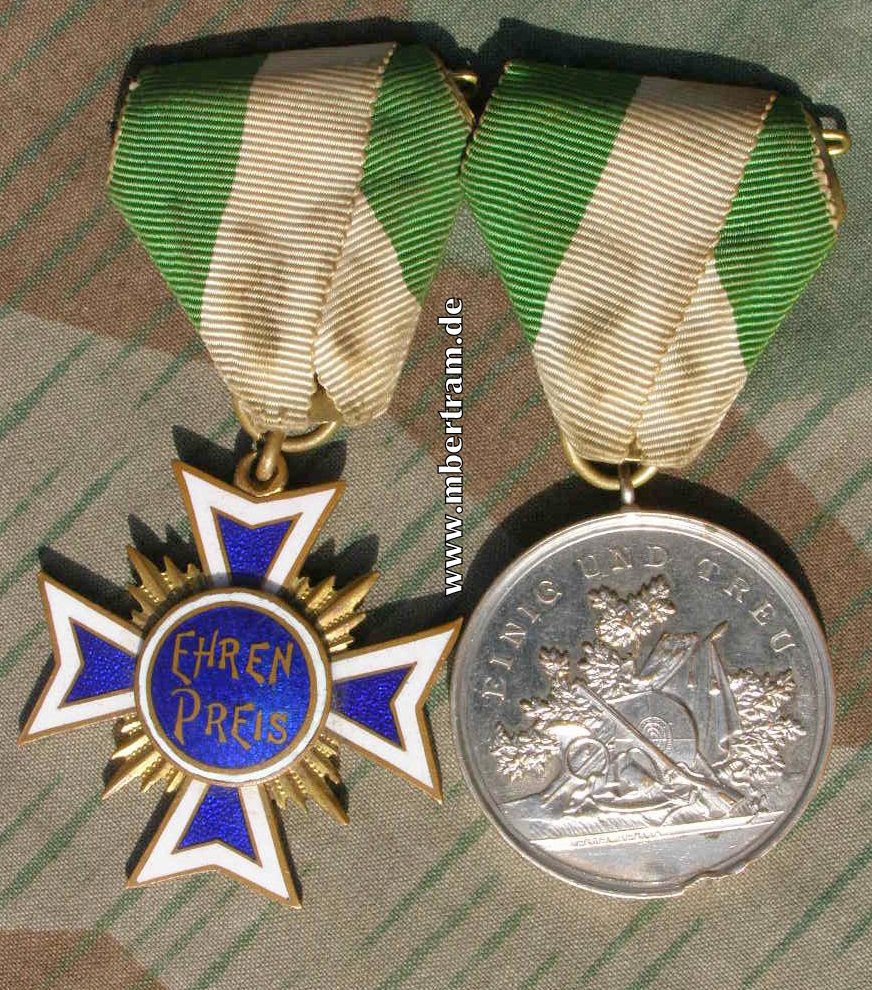 2 Schießauszeichnungen 1934/35, Medaille, massiv Silber.