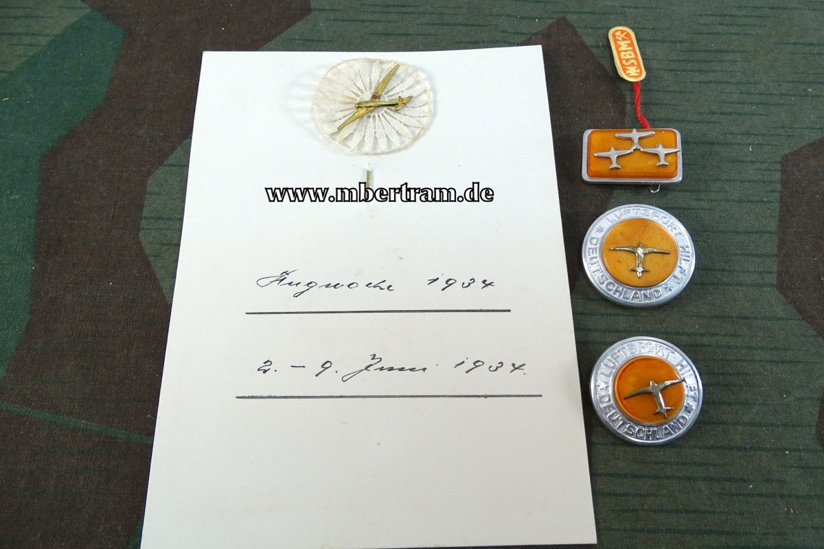 4 Abzeichen Luftfahrt, z.B. Flugwoche 1934. u. 3 Aluabzeichen mit Bernsteinkern.