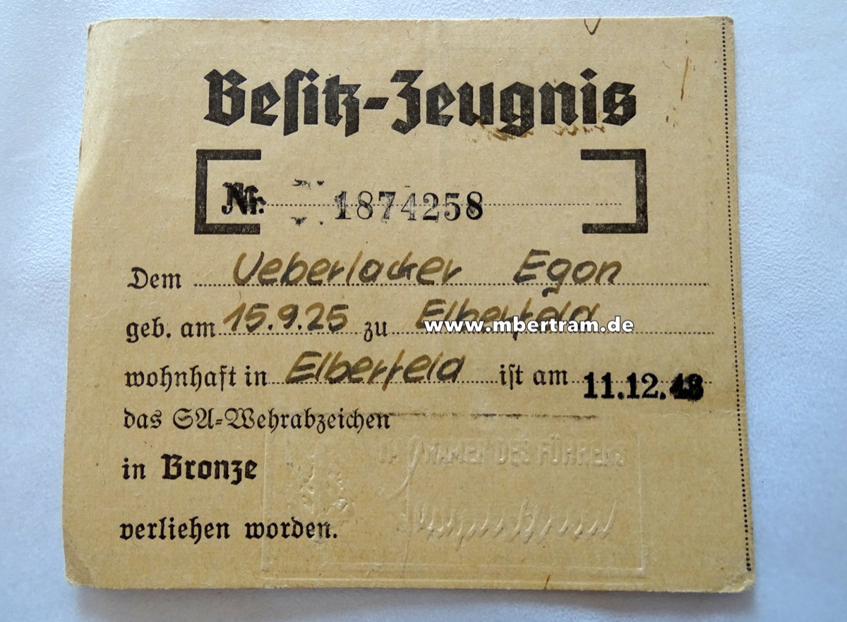Besitzzeugnis Egon U. 11.12.43, SA Wehrabzeichen in Bronce
