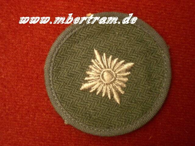 Ärmelabzeichen Oberschützenstern auf feldgrauem Tuch