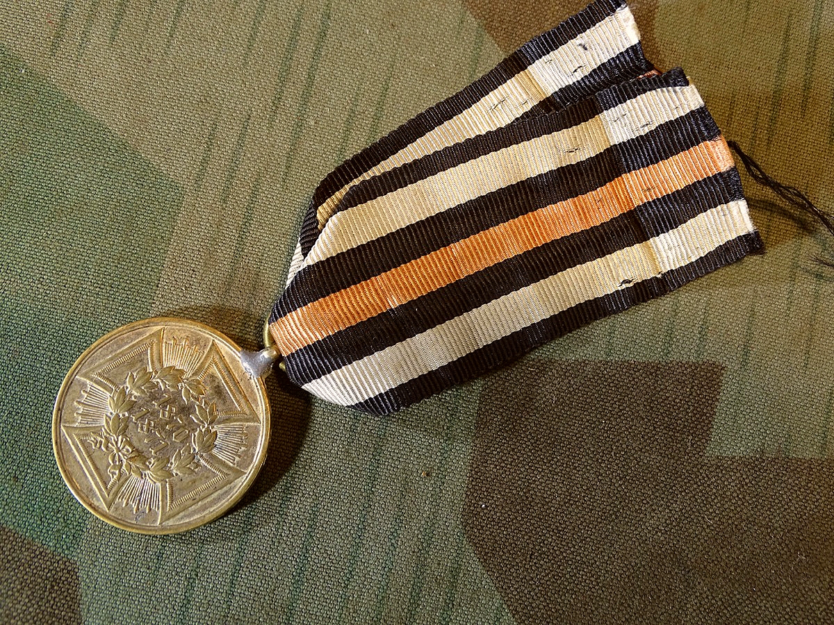 Kriegsdenkmünze 1870/71, Buntmetall. Aus erobertem Geschütz mit Band