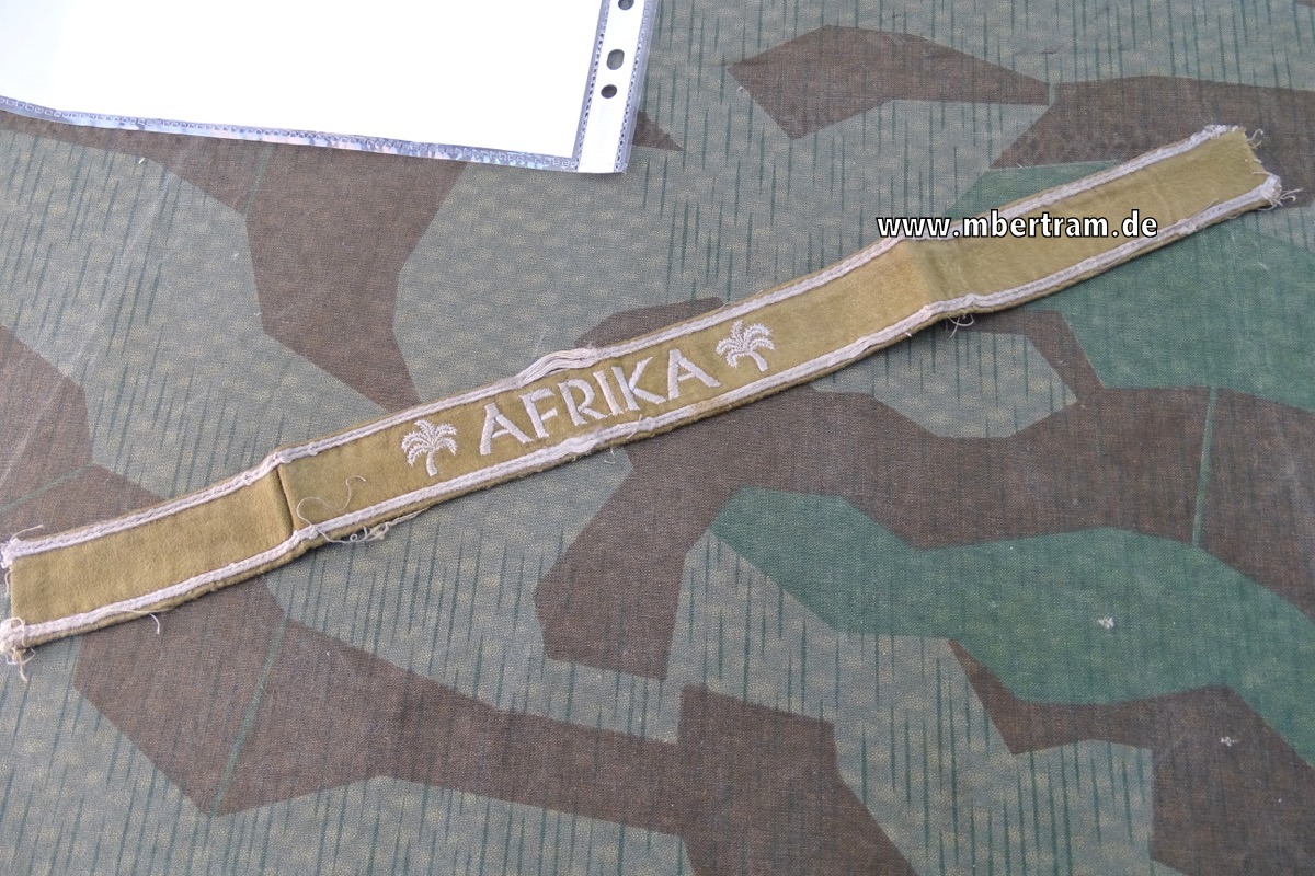 Ärmelband "Afrika", maschinengestickte Ausführung mit Expertise